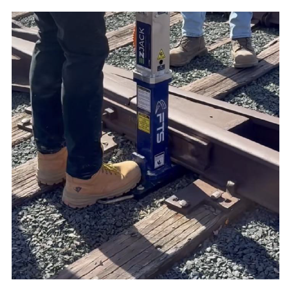 Position the FTS Rail EZ-Jack underneath railroad rail or tie
