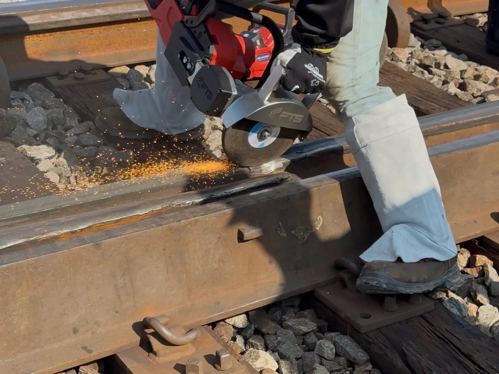 Track worker grinding a railroad frog with the FTS Rail Frog Grinder