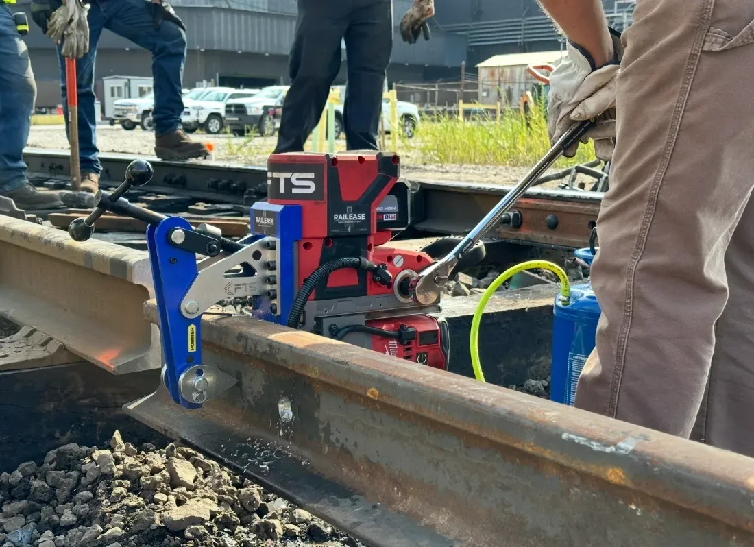 Trackworker drilling railroad rail with RailEase