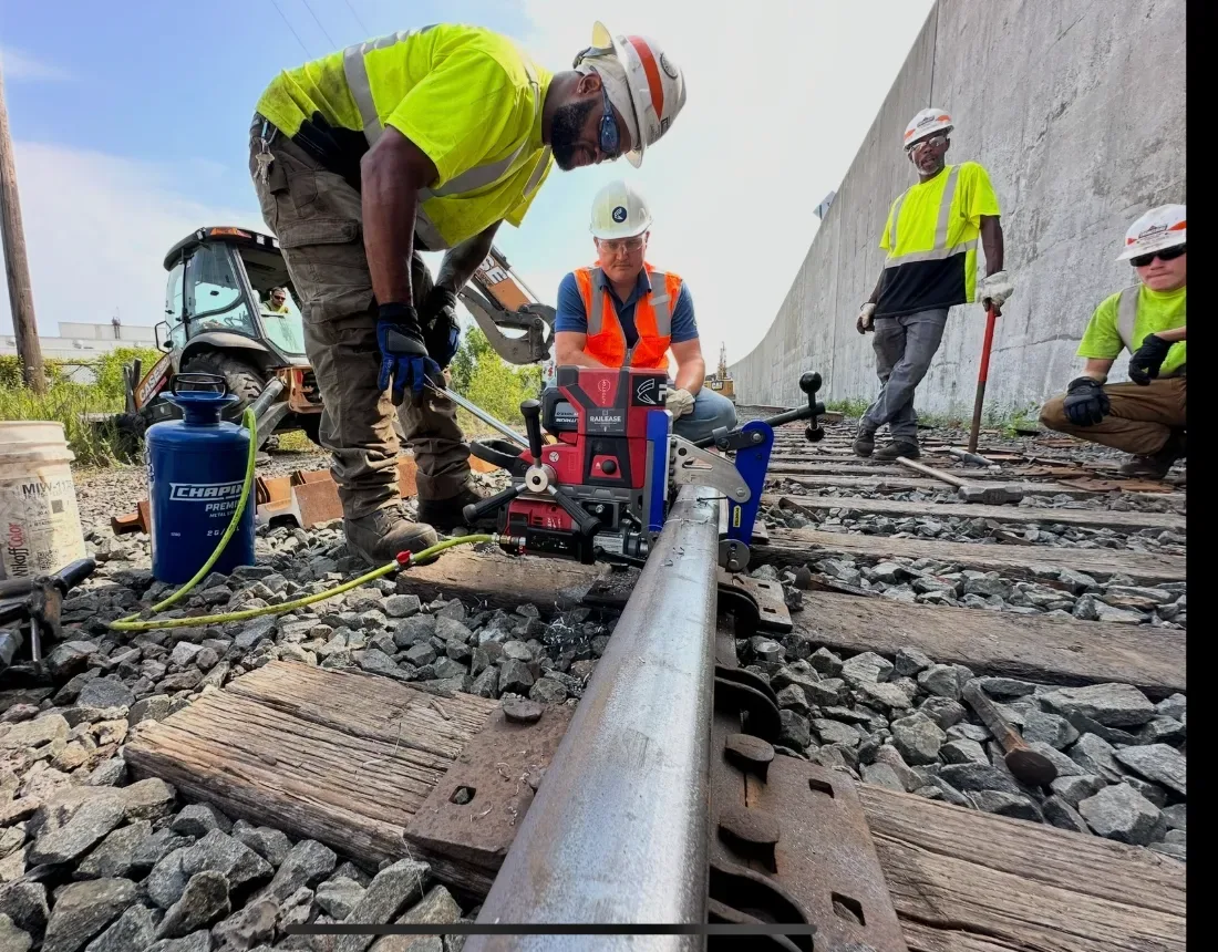 Rail crew using RailEase to drill rail in the field
