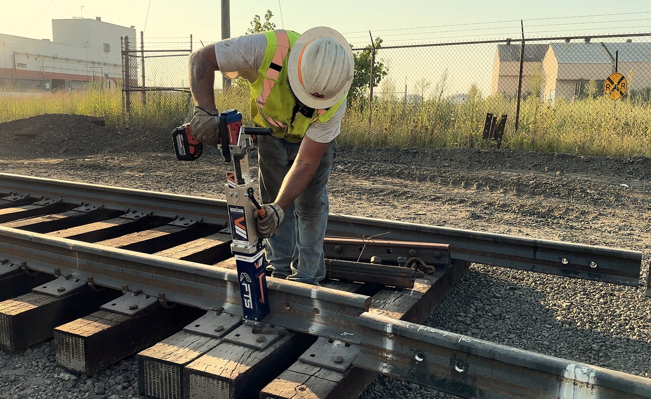 Railroad crew working with the FTS Rail SpikeEase spike puller
