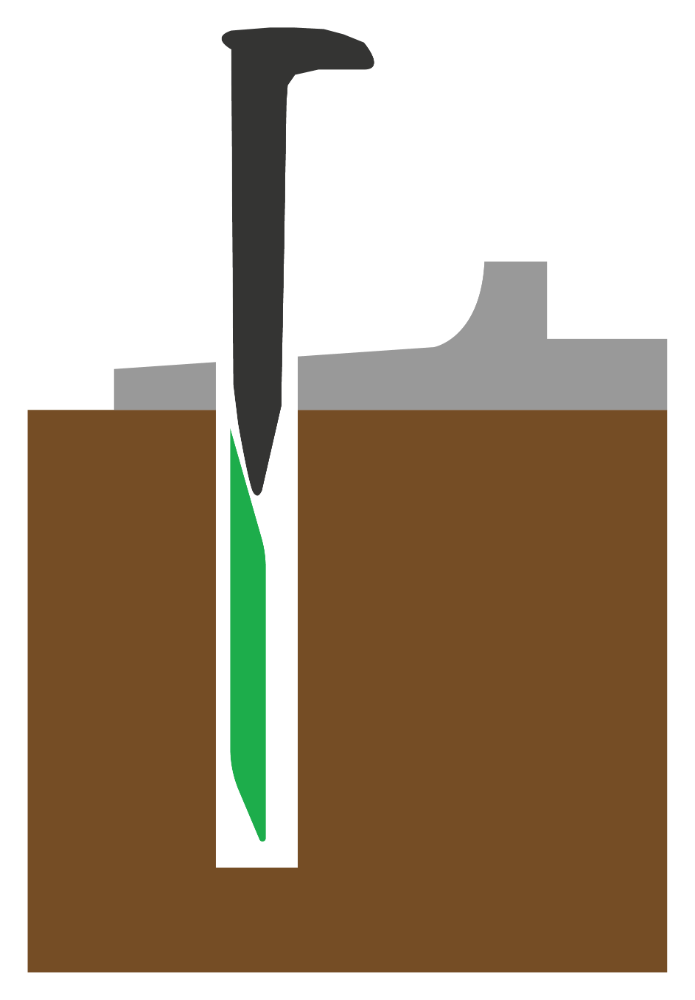 Cross-section of a wood railroad tie showing SpikePlug beneath a set spike and tie plate